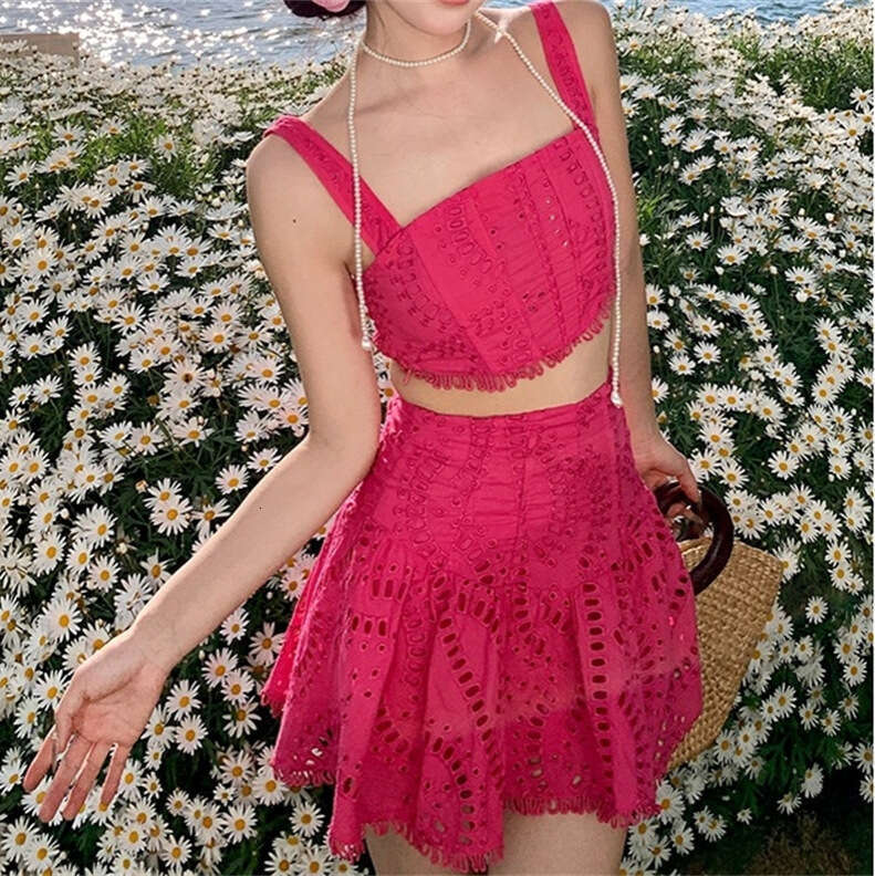 2026 spring and summer women's niche vacation style cotton embroidered hollow vest high waisted skirt set