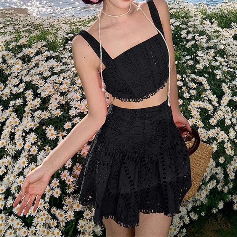2026 spring and summer women's niche vacation style cotton embroidered hollow vest high waisted skirt set