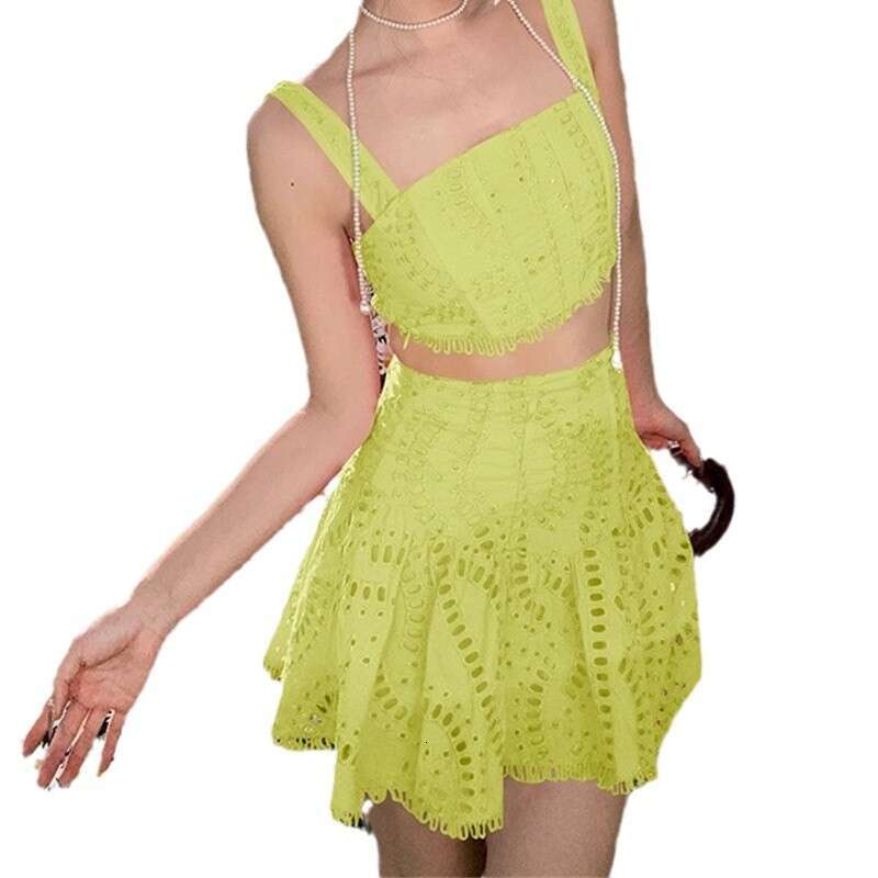 2026 spring and summer women's niche vacation style cotton embroidered hollow vest high waisted skirt set