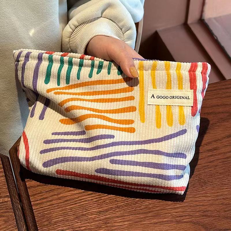 2025 autumn new corduroy color block striped simple makeup bag elegant niche design lightweight travel skincare storage bag wash bag bag designer hand