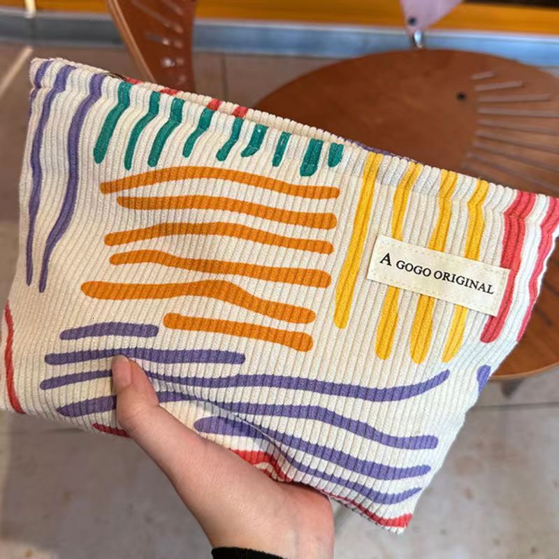 2025 autumn new corduroy color block striped simple makeup bag elegant niche design lightweight travel skincare storage bag wash bag bag designer hand