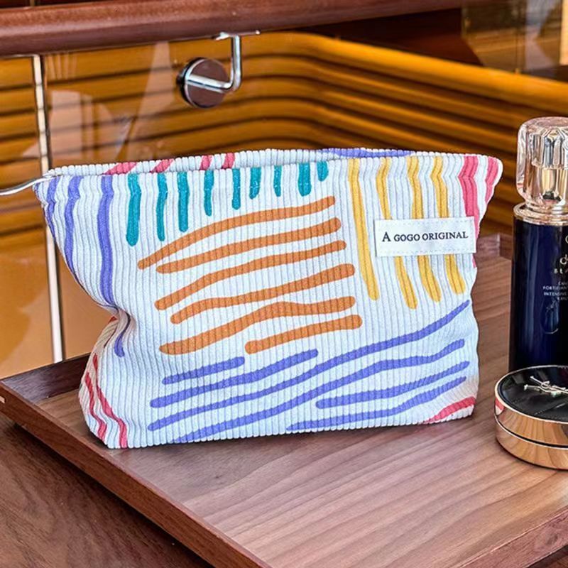 2025 autumn new corduroy color block striped simple makeup bag elegant niche design lightweight travel skincare storage bag wash bag bag designer hand