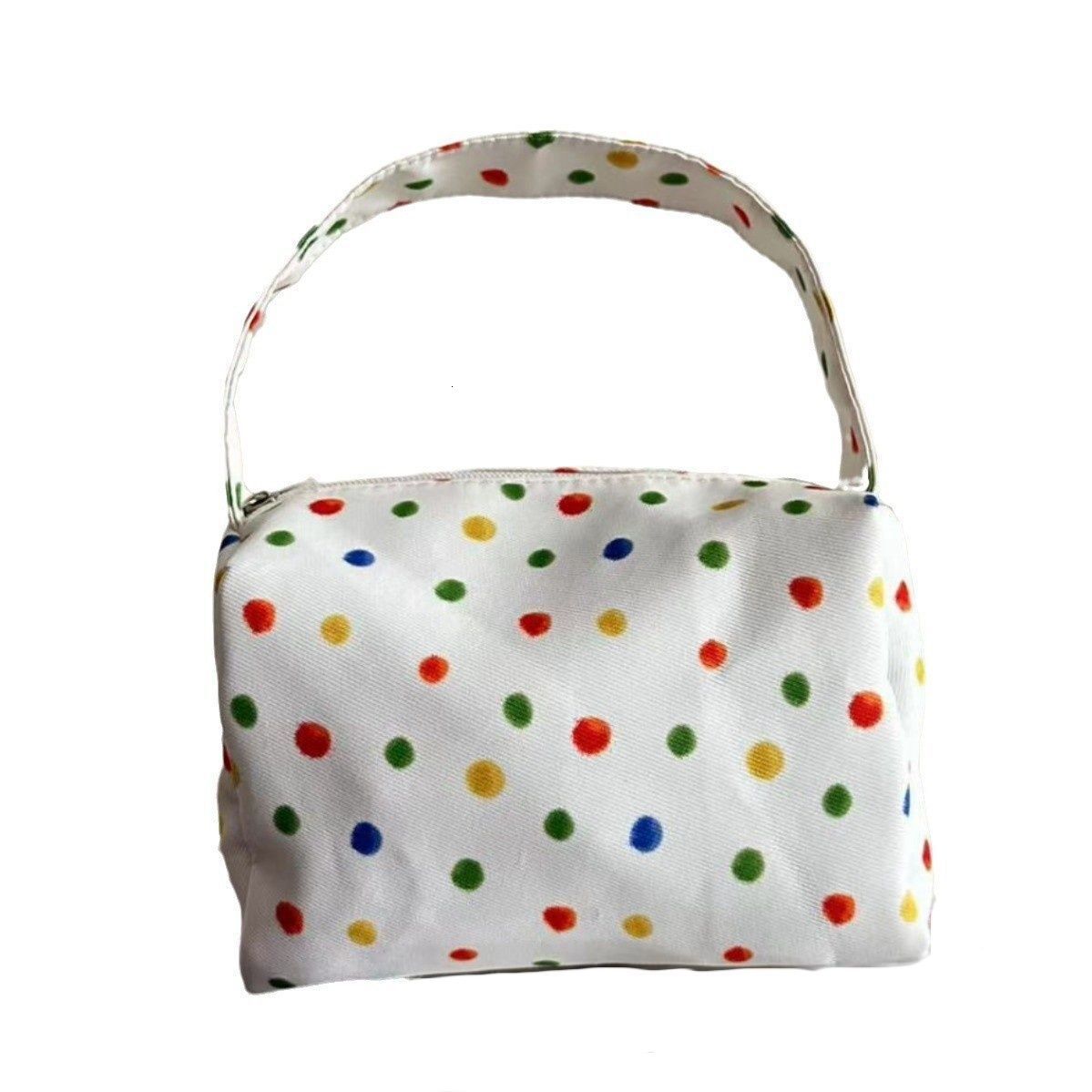 2025 autumn new polka dot compact simple bag elegant niche design makeup bag light luxury large capacity storage lightweight designer handbag