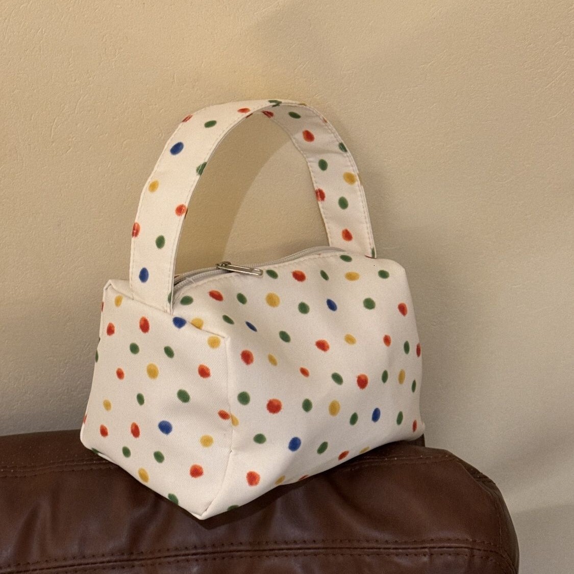 2025 autumn new polka dot compact simple bag elegant niche design makeup bag light luxury large capacity storage lightweight designer handbag