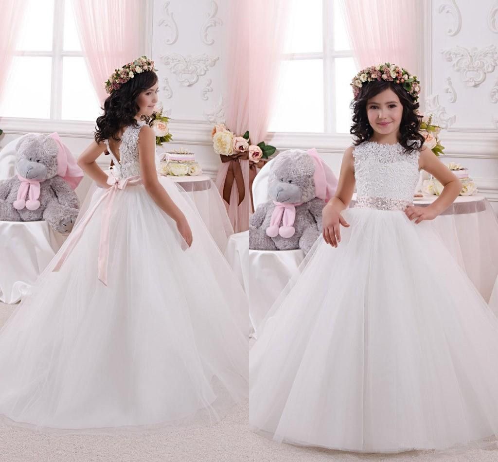 The Basics Whether you wish to dress your littlest guest in sparkles, lace or tulle, there's a sweet gown here to celebrate romance in bloom! There's nothing quite as sweet as an animated little flower girl as she floats down the aisle, wearing an ear-to-ear grin.