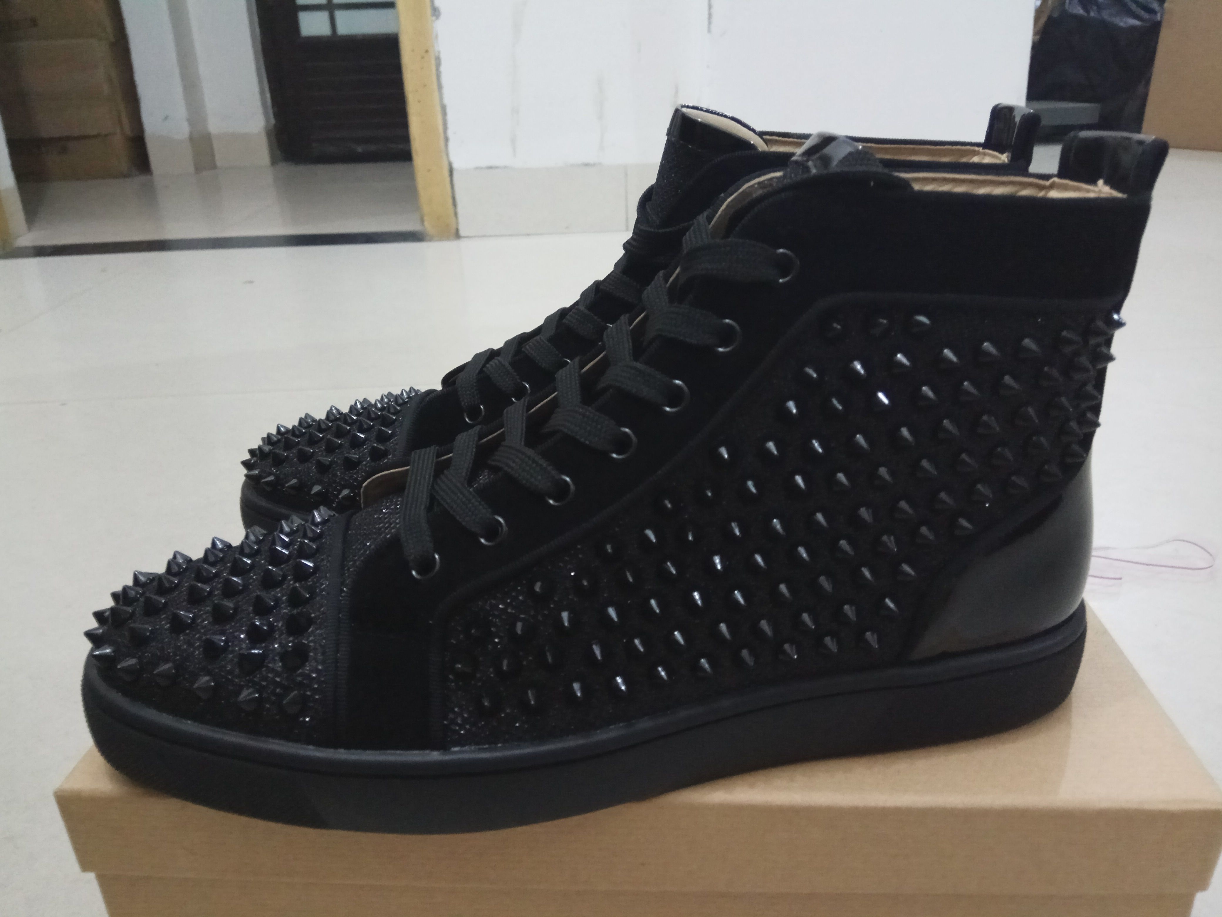 red bottom flats with spikes
