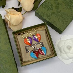 Aretes en forma de corazón de plata y oro de 18 quilates, anillos, aretes con patrón de relámpagos personalizados, aretes de diseñador de nicho para mujeres, regalos de fiesta, joyería de diseñador.
