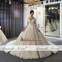 2022 Light Champagne V Neck Crystal Lace Ball Gown Wedding D...