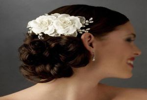 2015 Tocado Flores para el cabello nupcial Perlas Flores hechas a mano Peine de cristal Velo de novia de marfil Accesorios de boda Dhyz 018383809
