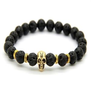 2015 nuevos productos enteros 10 Uds lote cuentas de piedra de Lava de 8MM pulseras elásticas de calavera de oro de 24K para hombres y mujeres Gift241g