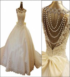 2019 Nouvelles robes de mariée Bling Crystal Scoop Appliques Perles Backless Pearl Bows Robe de bal Court Train Lace Tulle Luxury Custom BR2575341