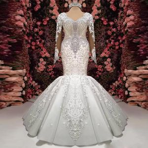 2024 Nouvelles robes de mariée de sirène magnifiques à manches longues en V Cyle Crystal Crystal Applique Puffy Bottom Bridal Bridal Sheer Back Vestidos de Novia