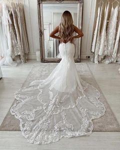 2022 Moderne Dentelle Sirène Robe De Mariée Longue Queue Sexy Dos Nu Keyhole Boho Plage Robes De Mariée Appliques Jewel Cou Sans Manches Robes De Mariée Blanc Ivoire