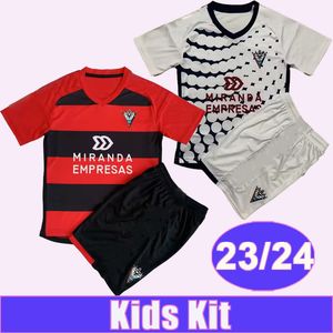 2023 2024 Mirandes Kids Kit Soccer Jerseys A. REINA CARLOS MARTIN BAEZA DAVID V. BARBU S. BARCIA TACHI ALVARO SANZ Camisetas de fútbol local