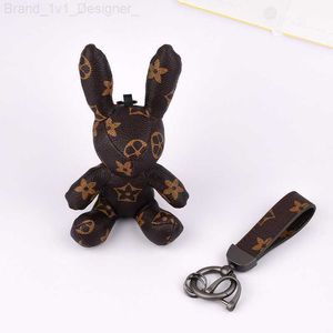 2023 Designer Key Rings Rabbit Pu Leather Kelechains Purse Prendant Car Course Chaîne charme Brown Flower Mini sac Couadel pour hommes Femme Accessories L230817