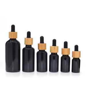 UV geçirmez ışığa dayanıklı doğal siyah cam malzeme sakal yağ damlası şişesi bambu kapaklı 5ml 10ml 15ml 20ml 30ml 50ml 100ml esansiyel yağ bambu damla şişesi