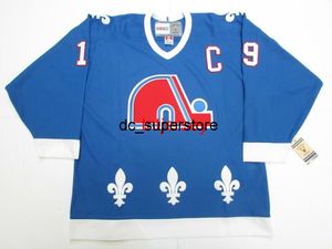 Ucuz özel JOE SAKIC QUEBEC NORDIQUES VINTAGE CCM HOKEY FORMA Dikiş herhangi bir numara ekleyin isim ERKEK ÇOCUK HOKEY FORMALARI XS-5XL