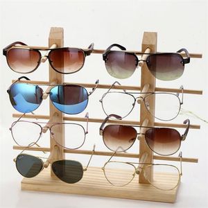 Многослойные деревянные солнцезащитные очки на дисплее стенды на шельфе очки отображают стойку держатель стойки для ювелирных украшений.