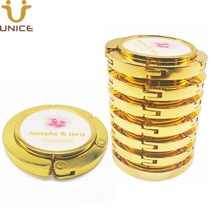 ADEDI 100 ADET Özelleştirilmiş Logo Altın Çanta Askı Ayna Olmadan Altın Renk Manyetik Katlanır Çanta Kanca Masa Çanta Tutucu Güzellik Düğün Hediyesi