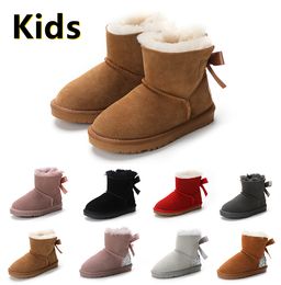 Bottes enfants bottes de neige Designer chaussures enfants hiver classique mini bouton de démarrage bébé garçons filles bottines enfant fourrure daim 22-35