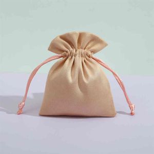 50pcs de haute qualité flanelle stockage velours sacs perles thé bonbons bijoux organza sac à cordon pour mariage cadeau de Noël Pouches264M