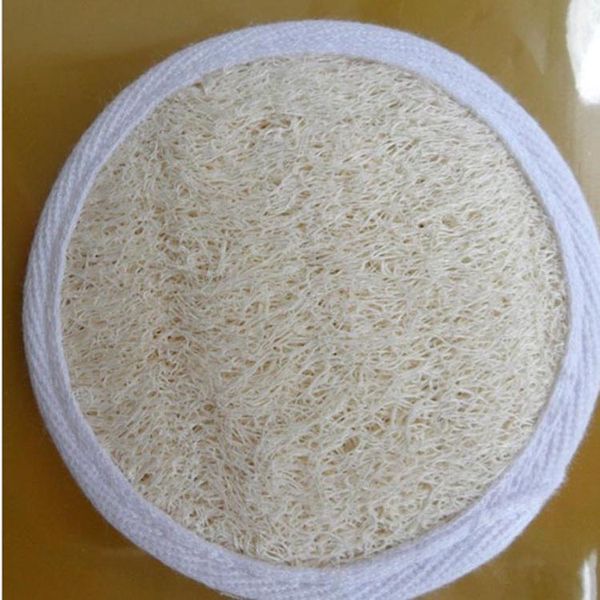 Natural facial brush with loofah exfoliating pad for skin buffing