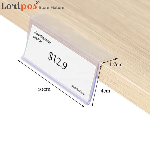 Plastic PVC L-shaped data strip sign clip bar with sticky shelf mount for price display and label holding, featuring duct tape