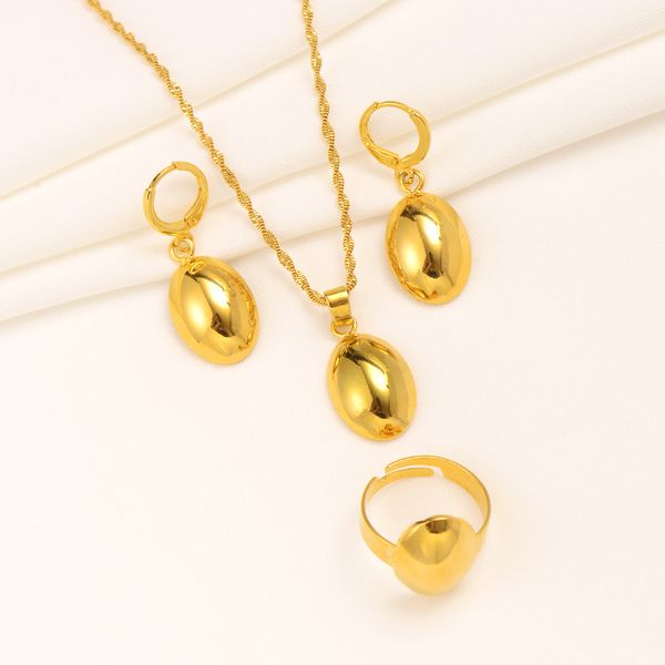18k yellow gold earrings with round bead pendants, matching necklace and ring set in traditional Indian Bollywood style