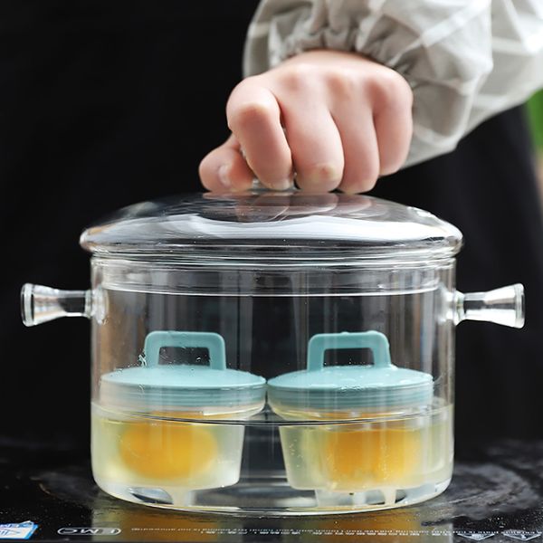 4-piece set of food-grade silicone egg cookers for breakfast steaming, including molds, water cup, and oil brush for kitchen use