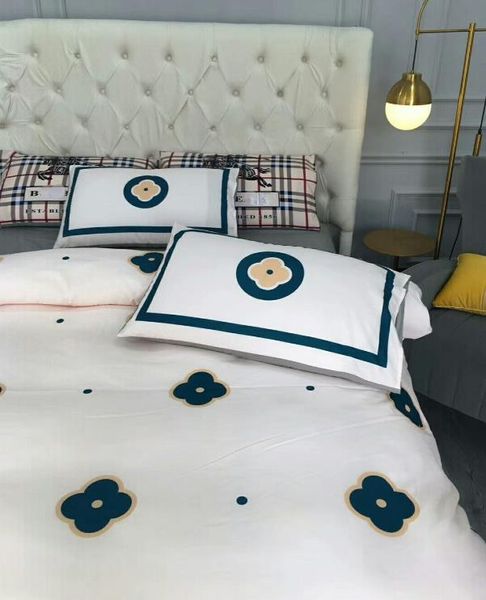 Designer luxury bedding set with printed bed sheet, cozy comforter, and warm pillowcase