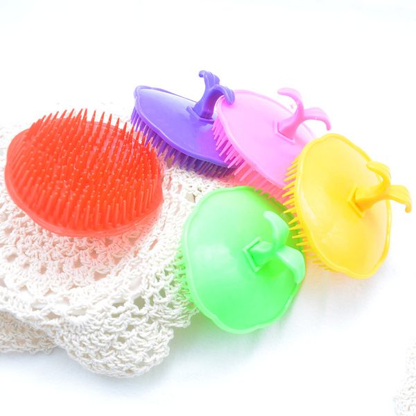 Comfortable scalp massager comb for shower, with colorful plastic bristles to clean and massage hair during shampooing