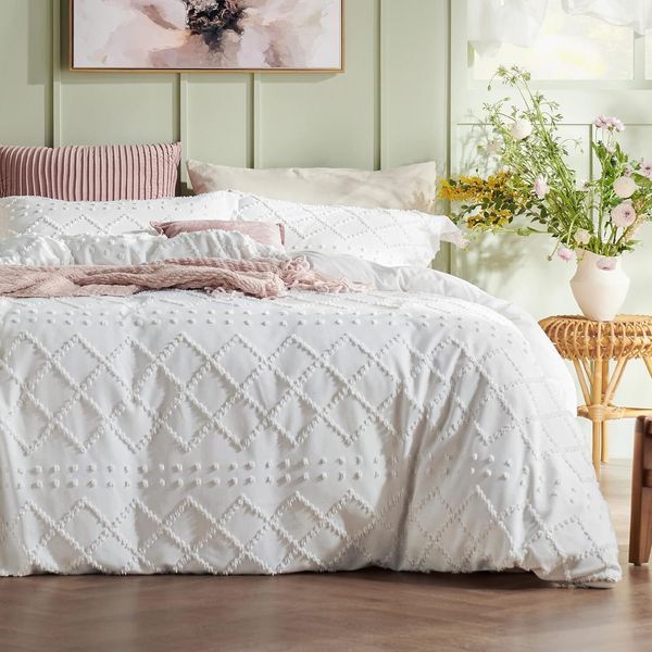 Bedsure's Bohemian-style bedding features a four-season plucked bed cover with three embroidered, nostalgic, and unique designs for your home duvet in white, medium size