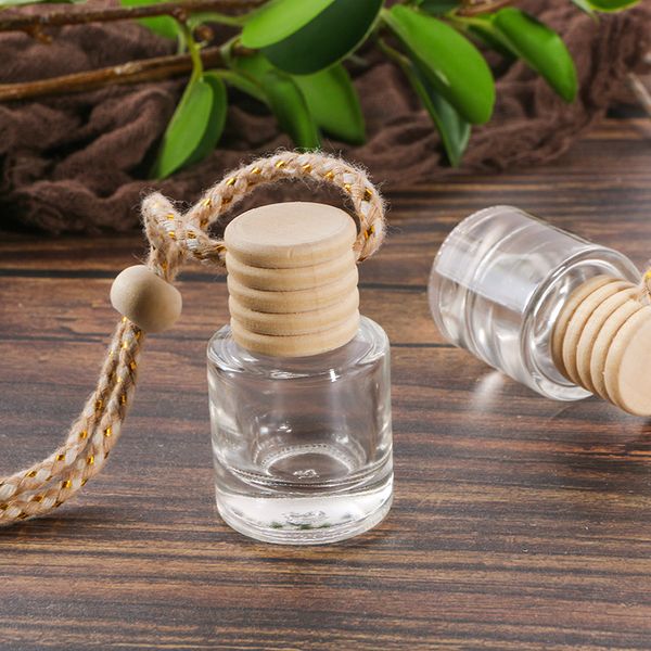 Car fragrance diffuser pendant with empty glass bottles for essential oils