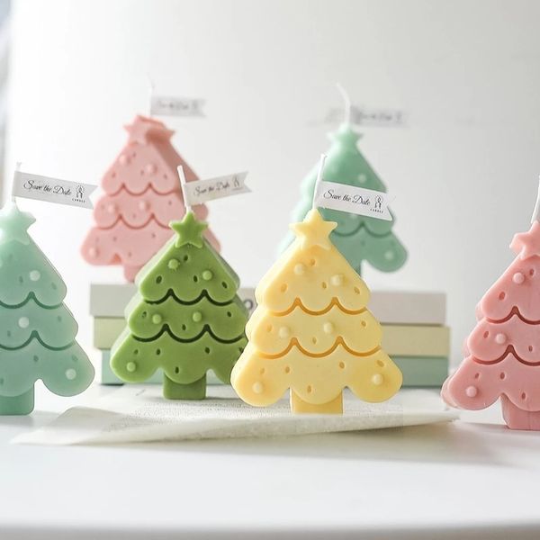 Handcrafted scented Christmas tree candles for festive decor, aromatherapy, and gifting