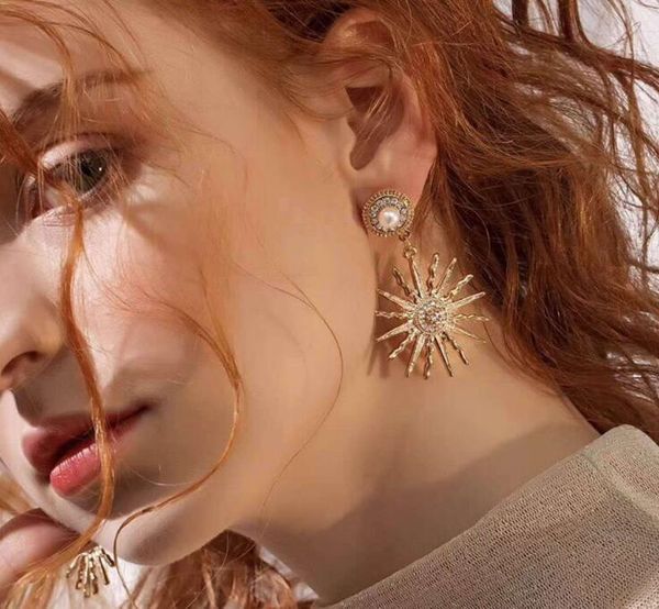 fashion- and american fashion personality golden sun flower earrings imitation pearl diamond metal earrings jewelry, Silver
fashion- and american fashion personality golden sun flower earrings imitation pearl diamond metal earrings jewelry, Silver