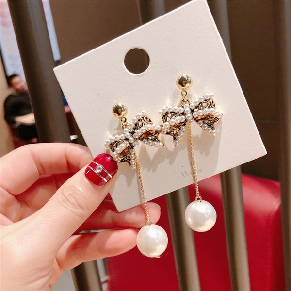korea style simple cute imitation pearl bow long silver pins drop earrings for girl women fashion jewelry accessories wholesale
korea style simple cute imitation pearl bow long silver pins drop earrings for girl women fashion jewelry accessories wholesale