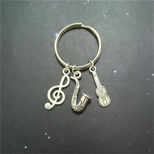 gift for teenage boy, music note key chain, violin keychain, sax keyring band musician gift saxophone charm, Silver
gift for teenage boy, music note key chain, violin keychain, sax keyring band musician gift saxophone charm, Silver