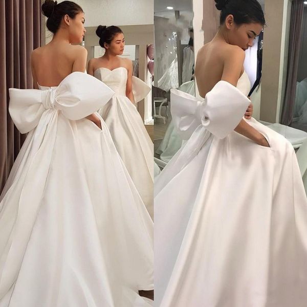 custom simple strapless satin wedding dresses with bow tie court train sweetheart backless a line wedding bridal gowns, White
custom simple strapless satin wedding dresses with bow tie court train sweetheart backless a line wedding bridal gowns, White