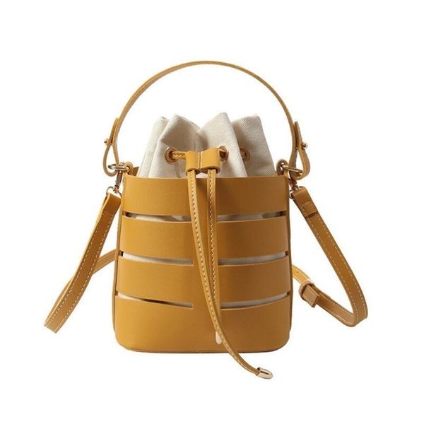 2019 new tide solid color hollow pu material small fairy bag portable bucket bag casual wild single shoulder messenger sac
2019 new tide solid color hollow pu material small fairy bag portable bucket bag casual wild single shoulder messenger sac
