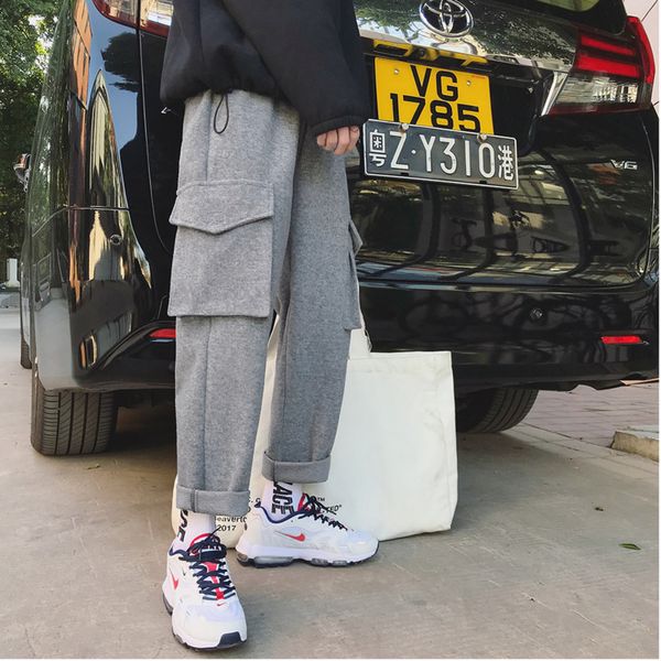 2019 autumn and winter thickening tooling material pants solid color loose simple straight pants large pocket black / gray m-2xl
2019 autumn and winter thickening tooling material pants solid color loose simple straight pants large pocket black / gray m-2xl