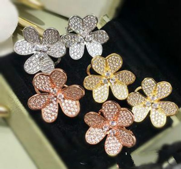 2020 new designer yellow gold plated copper full cz stone three leaf flower earrings for women 2019 selling new luxury fashion jewelry, Golden;silver 
2020 new designer yellow gold plated copper full cz stone three leaf flower earrings for women 2019 selling new luxury fashion jewelry, Golden;silver