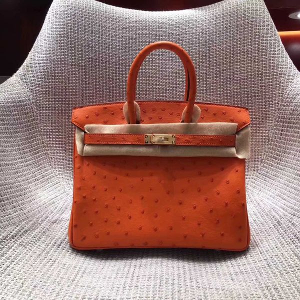 whosale fully handmade orange ostrich skin design purse 30cm wax thread, have both gold and silver hardware,contact me for details
whosale fully handmade orange ostrich skin design purse 30cm wax thread, have both gold and silver hardware,contact me for details