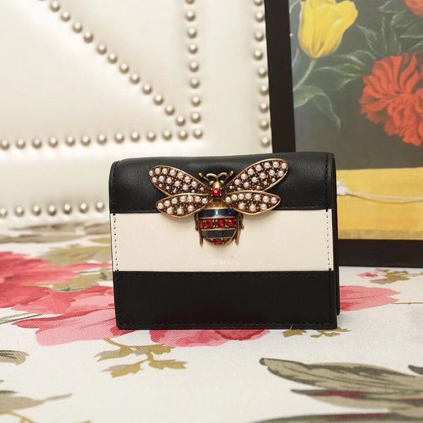 women sell short wallets. stylish and high-end style. little bee palace series. flap leather colorblock snap-on wallet, Red;black
women sell short wallets. stylish and high-end style. little bee palace series. flap leather colorblock snap-on wallet, Red;black