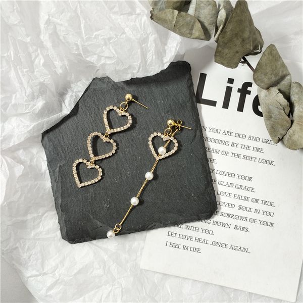 vintage pearl tassel asymmetric earrings for women korean peach heart stud earrings girl party jewelry, Silver
vintage pearl tassel asymmetric earrings for women korean peach heart stud earrings girl party jewelry, Silver