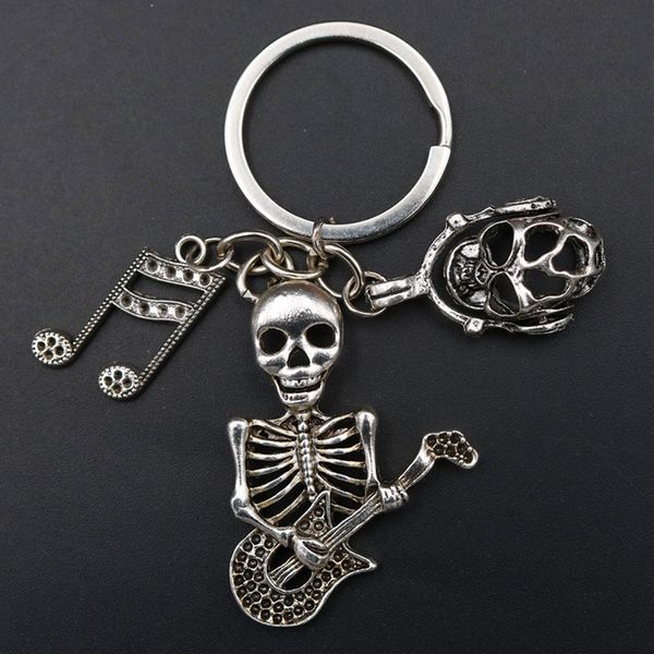 wkoud 1pc antique silver skull guitarist wearing headphones skull keychain creative diy metal punk band keychain a1679
wkoud 1pc antique silver skull guitarist wearing headphones skull keychain creative diy metal punk band keychain a1679