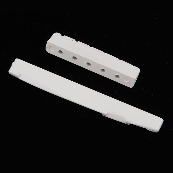 slotted guitar saddle nut white, made of plastic steel 
slotted guitar saddle nut white, made of plastic steel