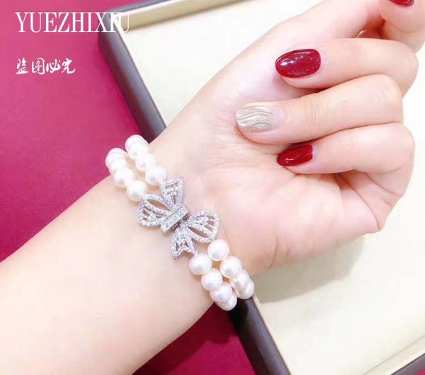 2 rows 7-8mm south sea white pearl hand knotted bracelet 7.5-8" natural zircon bowknot clasp, Golden;silver 
2 rows 7-8mm south sea white pearl hand knotted bracelet 7.5-8" natural zircon bowknot clasp, Golden;silver