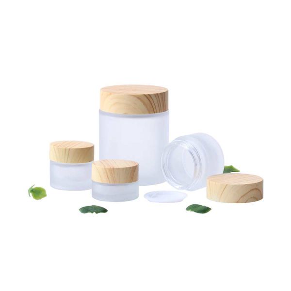 frosted glass jar cream bottles round cosmetic jars hand face easy to carry packing bottles 5g to 100g jars with wood grain cover
frosted glass jar cream bottles round cosmetic jars hand face easy to carry packing bottles 5g to 100g jars with wood grain cover