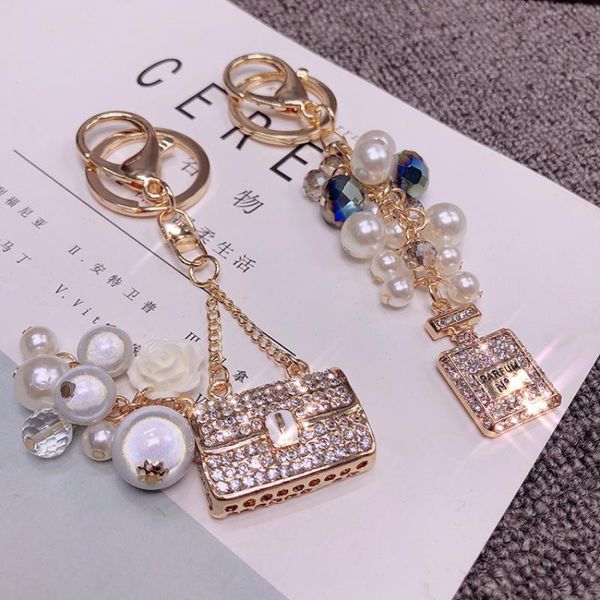 brand perfume bottle keychain full crystal bag with pearl for women car bag keyrings accessories ornament fashion chain, Silver
brand perfume bottle keychain full crystal bag with pearl for women car bag keyrings accessories ornament fashion chain, Silver