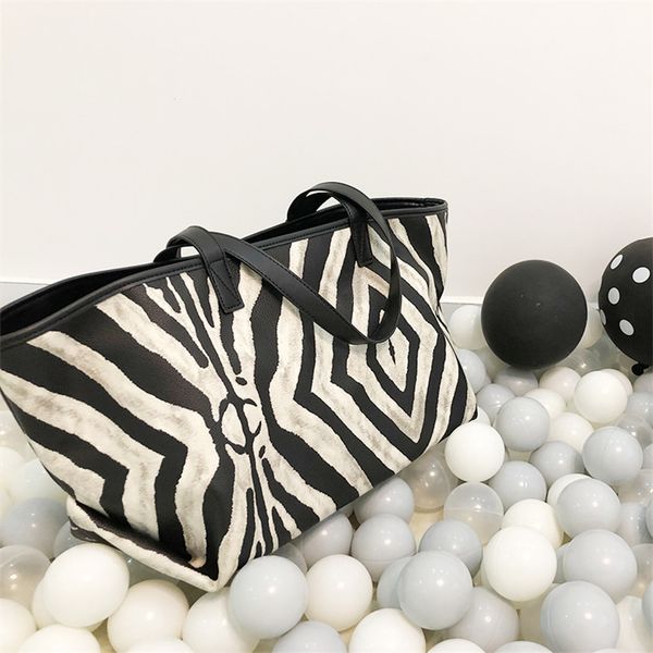 designer handbag zebra pattern portable new women's bag in large capacity travel single shoulder fashion versatile tote bag 6
designer handbag zebra pattern portable new women's bag in large capacity travel single shoulder fashion versatile tote bag 6
